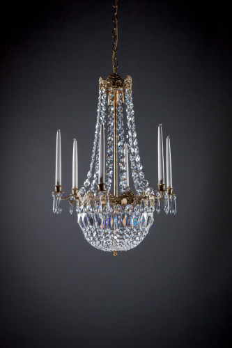 A glorious traditional sparkling crystal chandelier creates an atmosphere, a ceiling lamp for every home
